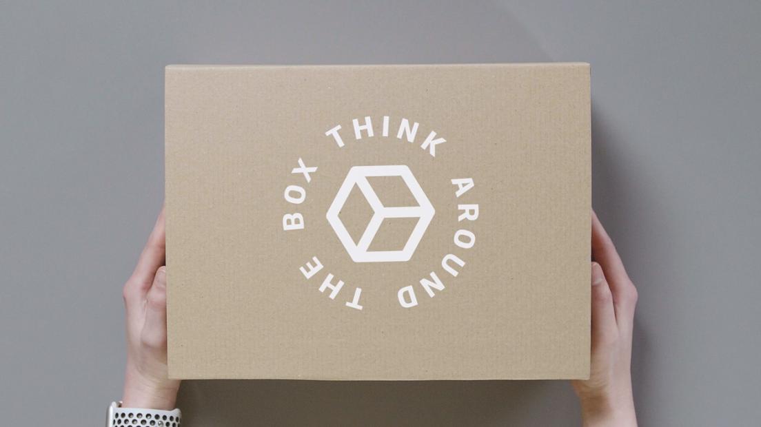 hand holding box of DS Smith with think around the box text